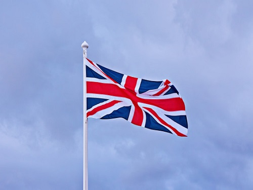 waving-flag-great-britain-against-blue-cloudy-sky-background_73661-885